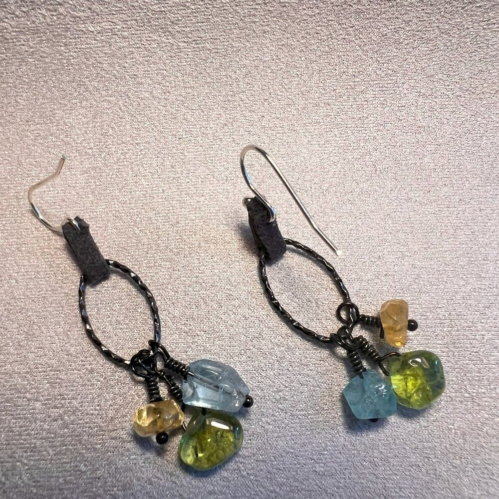 Silver Earrings with Leather Connection and Gemstone Chips hanging from a ring